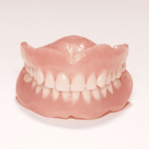 Traditional dentures with a white background.