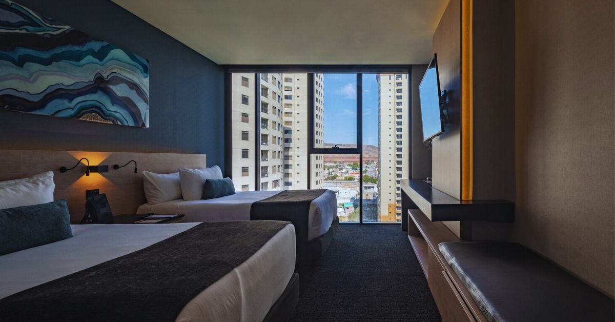 Beds in a room overlooking the city of Tijuana.